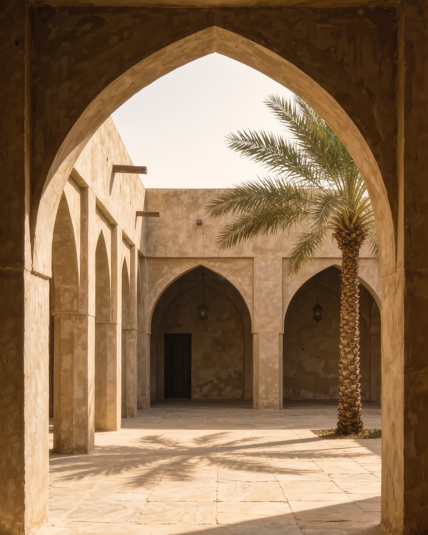 A quiet Kuwaiti courtyard, arches and palm shadows on warm stone